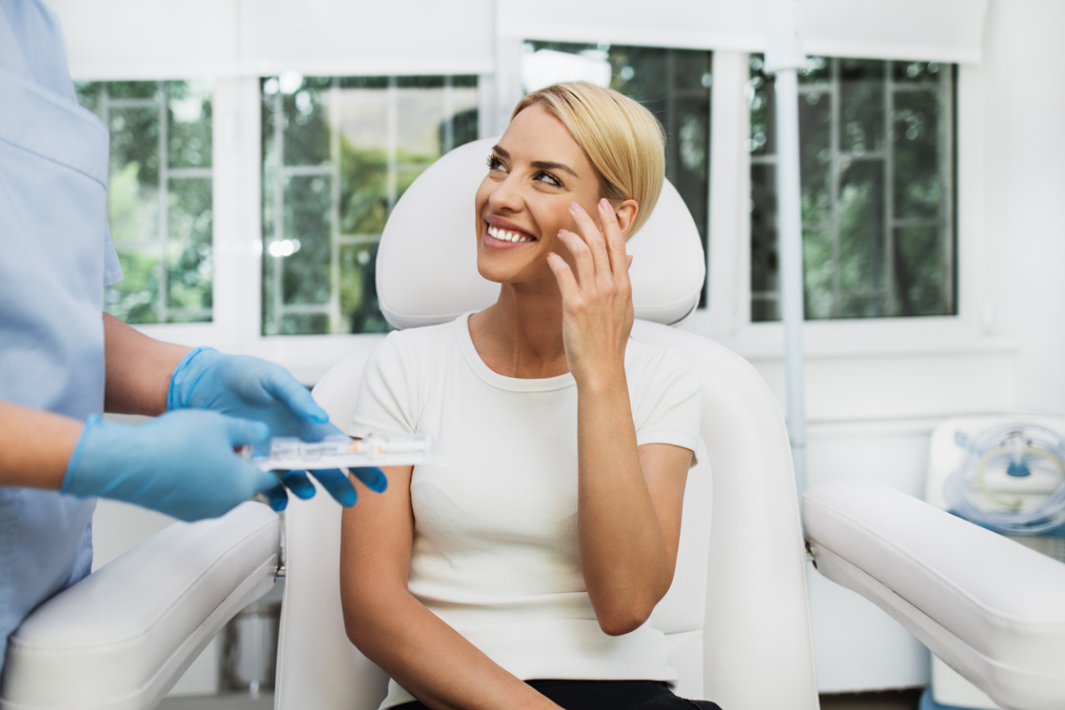 Woman listening to doctor explain the benefits of tumescent liposuction.