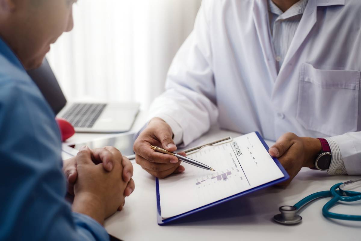 Doctor explaining to patients why awake procedures are safer.